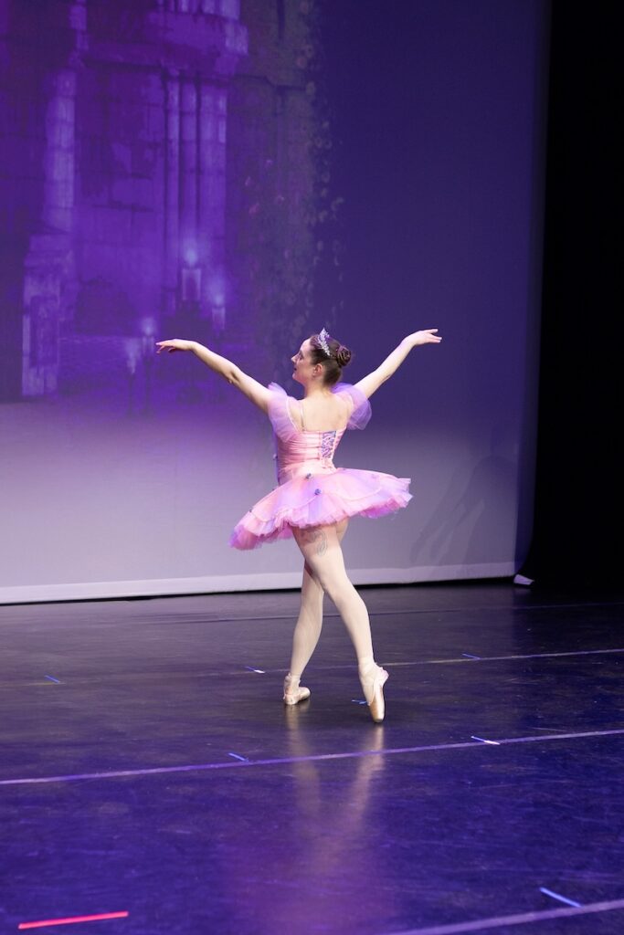 Ballerina performing on stage.