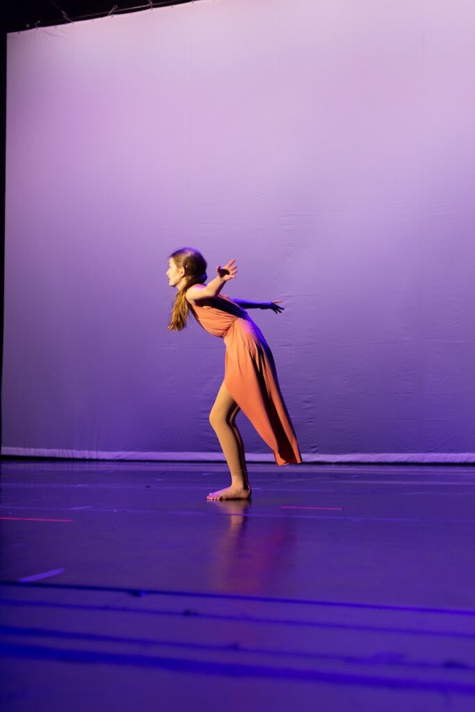 Modern dancer performing on stage.