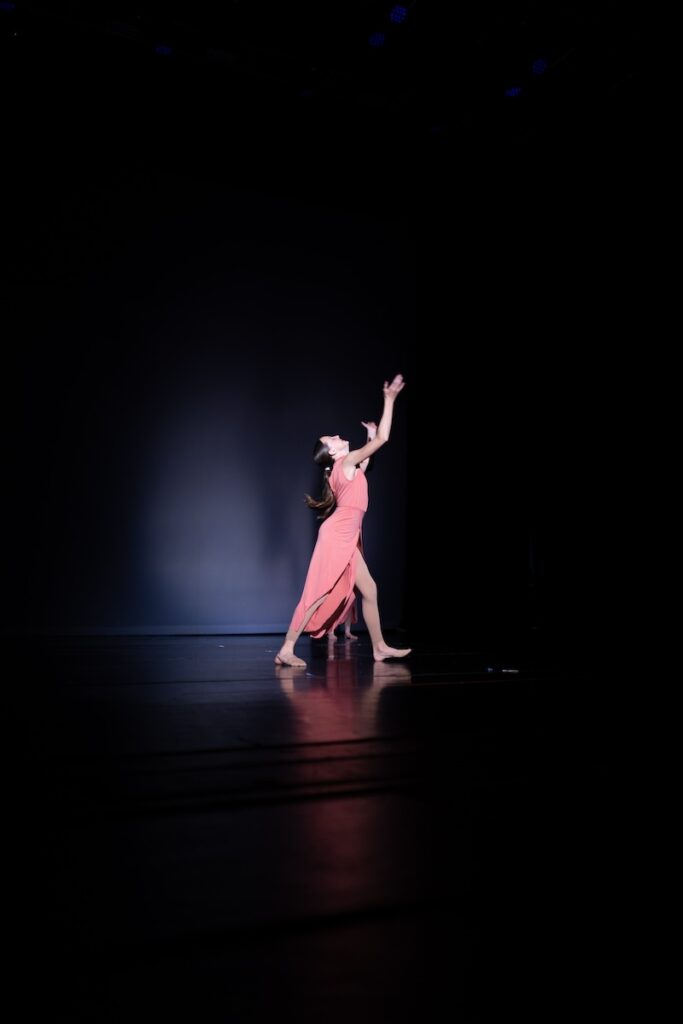 modern dancer spotlight, while performing on stage.