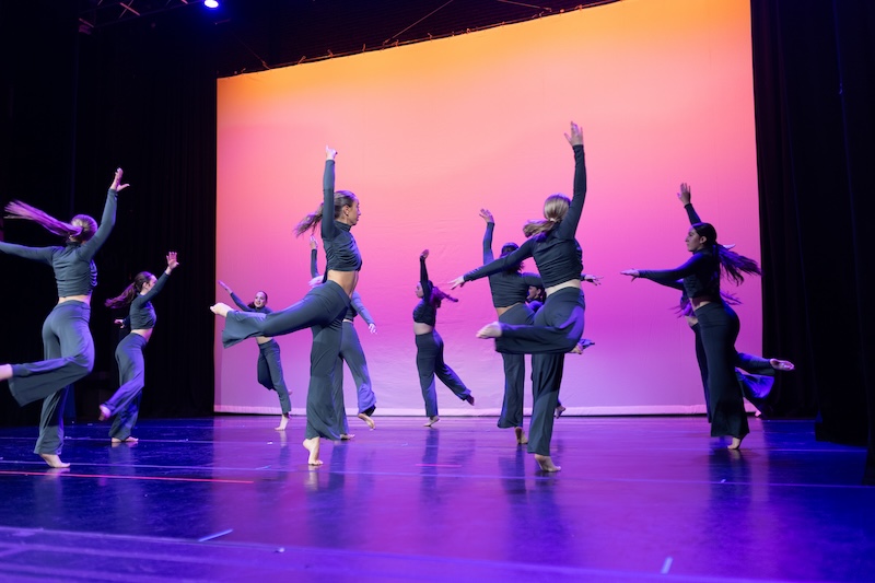 modern dancers performing on stage.