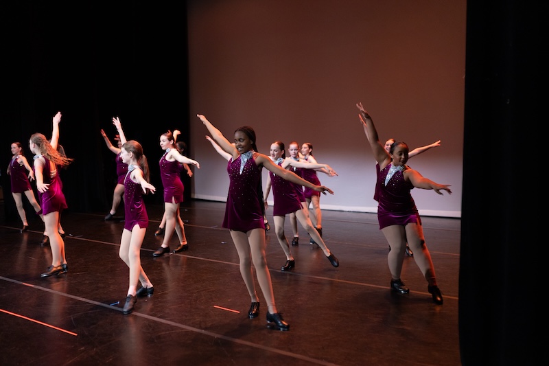 Tap dancers performing on stage.