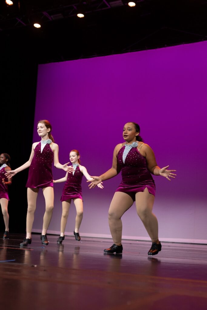 Tap dancers performing on stage.