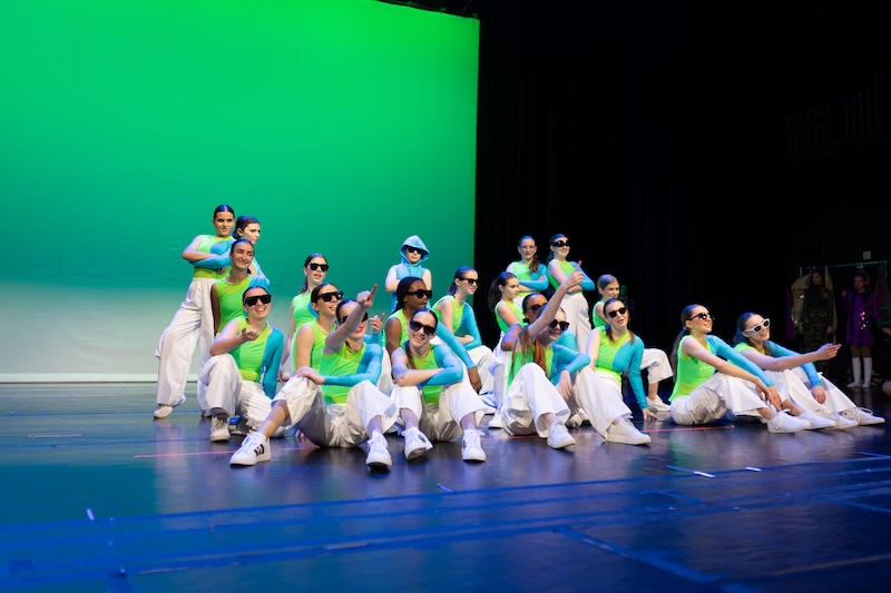 young hip hop dancers posing for photo on stage.
