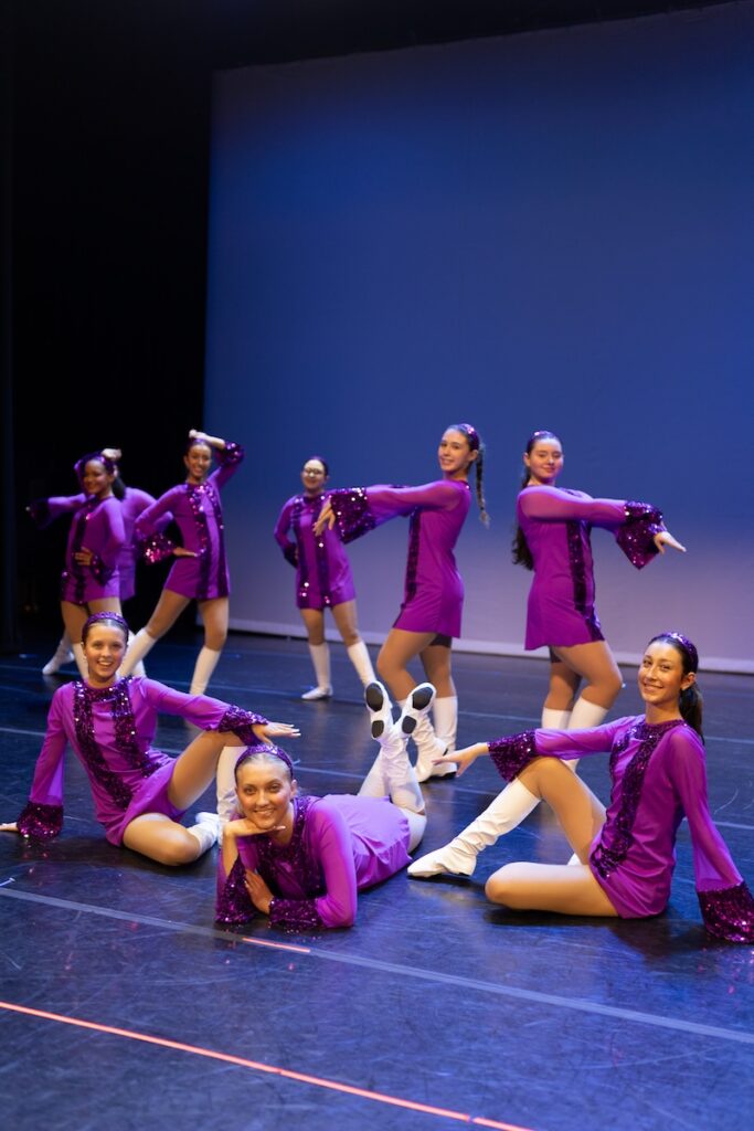 jazz dancers posing for group photo.