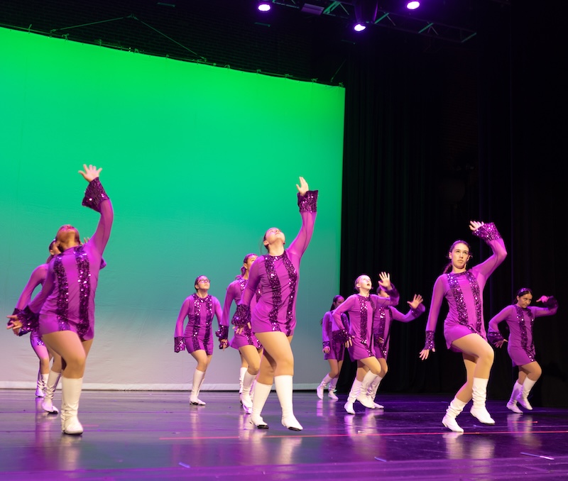 jazz dancers performing on stage.