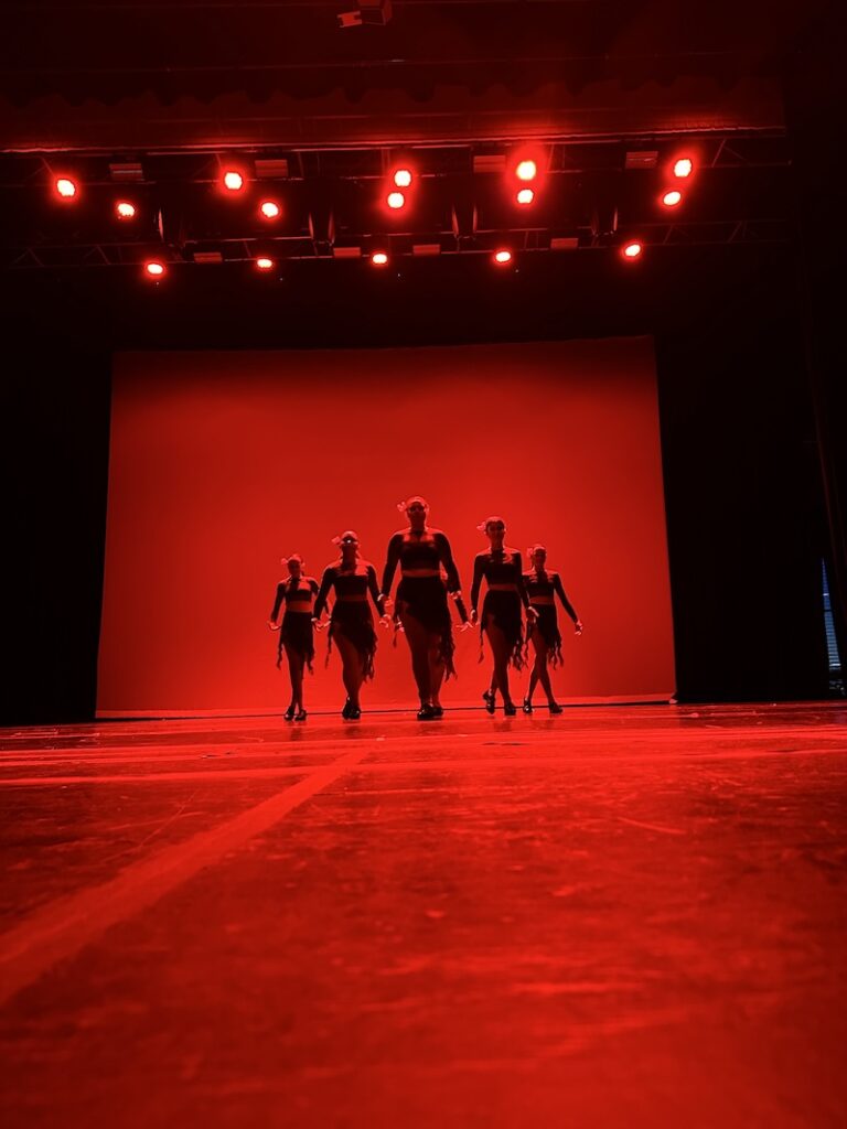 tap dancers performing on stage.