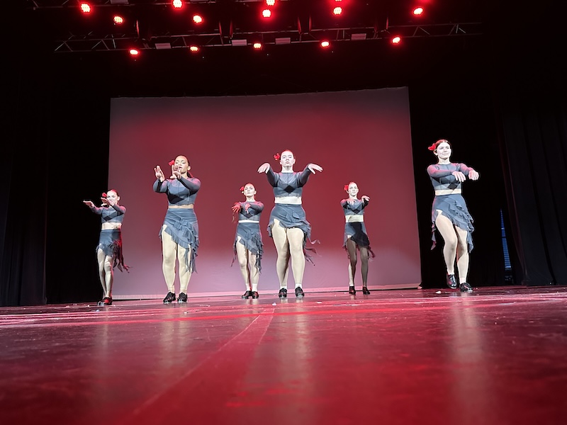 tap dancers performing on stage.