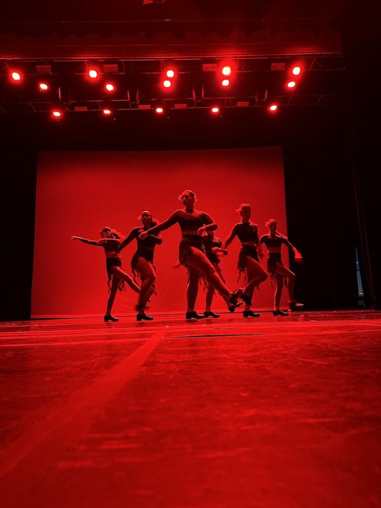 tap dancers performing on stage.